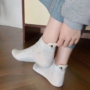 White polka dot ankle socks for women featuring cute dachshund embroidery on the heel
