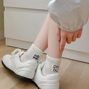 White cotton crew socks featuring cute puppy embroidery and casual style for women