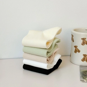 Detail of five-pair cotton sock set in assorted colors with fine ribbed knit texture