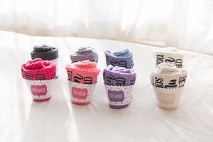 Cupcake-style gift packaging for colorful coral fleece fuzzy socks with wine slogans