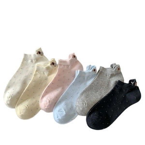 Set of six colorful polka dot cotton socks with cute dog embroidery on the heel