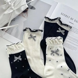 Women's cotton ruffle socks with bow details in polka dot and solid color styles