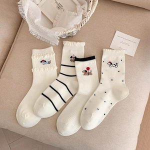 Set of 4 white cotton socks for women featuring cute dog embroidery and stylish patterns