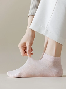 Detail showing high elasticity and ribbed knit texture of thin light pink modal low-cut socks