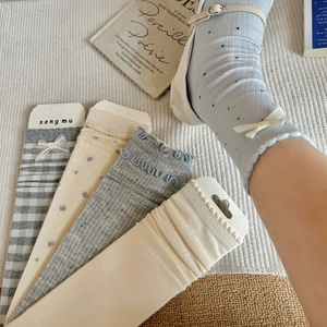 Japanese style gray blue bow socks with floral patterns worn with Mary Jane shoes
