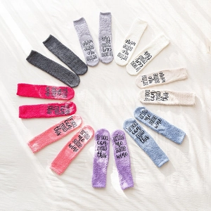 Cozy coral fleece slipper socks in 8 pastel colors with funny text on soles