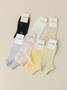 Detailed flat lay of colorful thin modal knit socks with breathable vertical ribbed texture