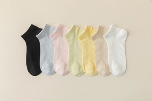 Detail of 7 pairs ultra-thin modal mesh socks in various pastel colors and ribbed knit
