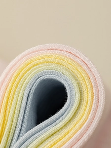 Detailed macro view of pastel mesh knit socks showing soft texture and weave