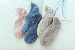 Detailed view of winter thermal coral fleece socks with anti-slip silicone grip on sole