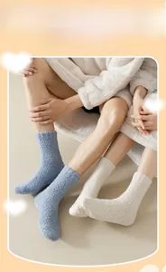 Detail of coral fleece winter socks in blue and beige showing thick fuzzy texture