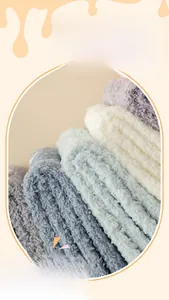 Close-up of thick coral fleece fabric in pastel colors showing soft plush texture
