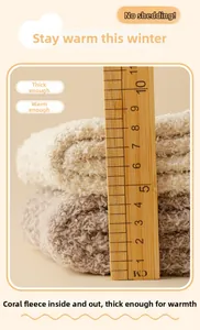 Detail shot showing 10.5cm thickness of coral fleece warm socks with a soft texture