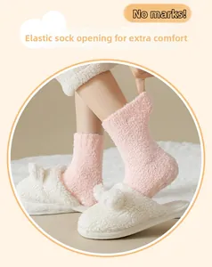Detail showing elastic non-marking cuff of pink coral fleece socks for cozy home wear