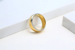Macro view of bicolor gold and silver tungsten steel ring with polished inner surface
