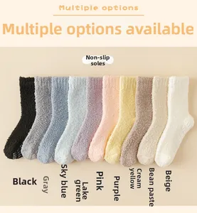 Detailed flat lay of 10 colorful coral fleece socks with anti-slip silicone grippers