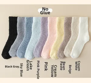 Ten solid color fuzzy coral fleece socks displayed in a diverse soft color palette