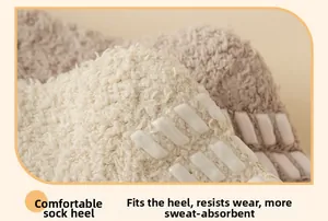 Close-up of non-slip silicone strips on the heel of thick coral fleece thermal socks