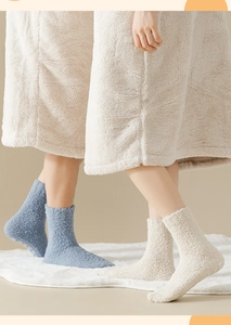 Detailed close-up of thick coral fleece socks with ultra-soft texture in morandi blue
