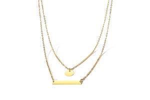 Close-up of gold double layer necklace with circular disc and bar pendants on white background