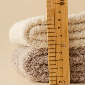 Thick coral fleece socks in beige and khaki with non-slip grips for winter warmth