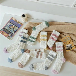 Thick coral fleece socks featuring striped patterns and contrasting toe details