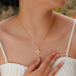 Elegant gold zircon flower pendant necklace for women shown on a model neck