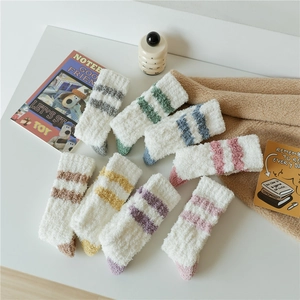 Close-up of soft coral fleece striped socks showing thick warm texture and plush materials