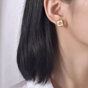 Boucles d'oreilles vintage en acier inoxydable avec incrustation de coquille blanche