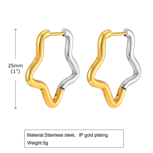 Detail view of 25mm stainless steel star earrings with two-tone gold and silver finish