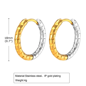 Close-up of 18mm two-tone stainless steel U-shaped earrings with pyramid texture