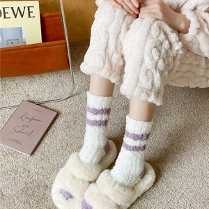 Warm coral fleece crew socks in white with purple stripes for home comfort in winter