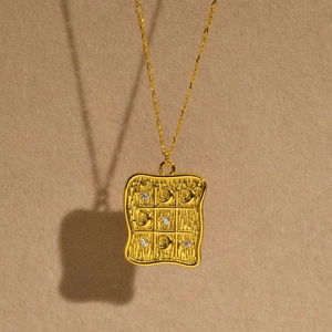 Golden rectangular celestial grid pendant necklace with moon and star zircon details