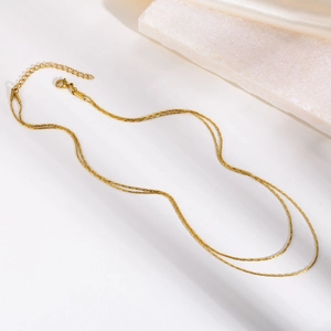 Double-layered golden stainless steel necklace with fine chains and adjustable lobster clasp