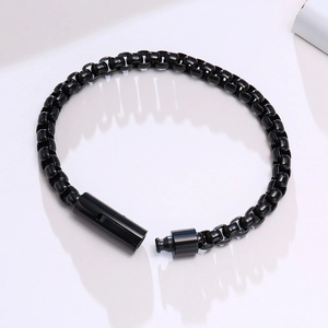 Detail view of smooth black stainless steel box chain bracelet with cylinder clasp
