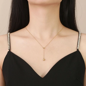 Elegant gold titanium heart necklace in Y-shape design on a female model neck