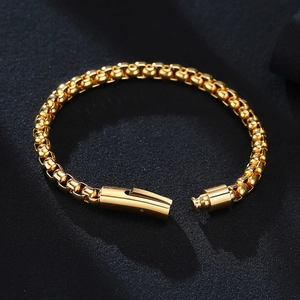 Detail of gold-plated stainless steel block chain bracelet with secure push-pull clasp