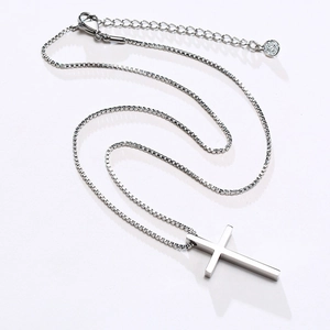 Detailed view of silver cross pendant with venetian box chain and adjustable lobster clasp