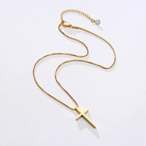 Detail of gold stainless steel cross pendant with box chain and crystal extension
