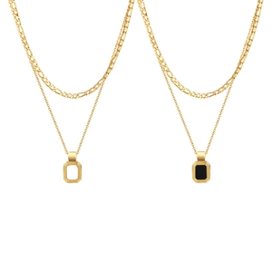 Gold double-layered necklace featuring Figaro chain and rectangular pendant tags