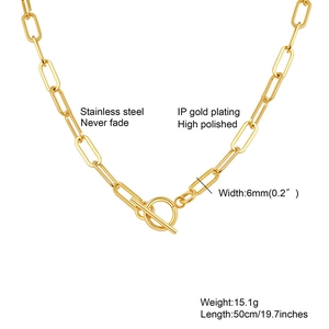 Macro detail of gold stainless steel paperclip chain necklace with toggle clasp and IP plating