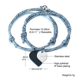 Detail of adjustable braided magnetic couple bracelets with heart puzzle pendants