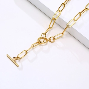 Golden stainless steel paperclip chain necklace featuring an elegant OT toggle clasp