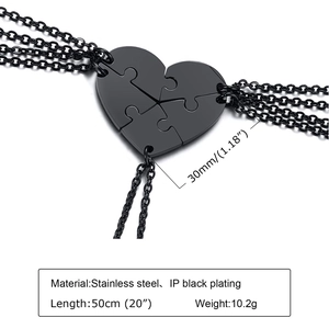 Macro detail of black stainless steel heart puzzle necklace pieces with size annotations
