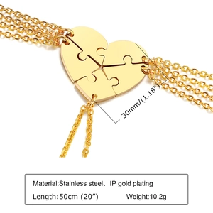 Detail of four-piece gold puzzle heart necklaces in stainless steel with dimensions