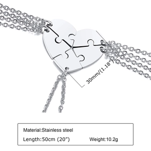 Macro shot of a four-piece stainless steel puzzle heart necklace with dimensions info