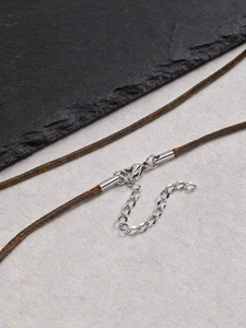 Detail of brown braided wax cord necklace with silver lobster clasp and extension chain