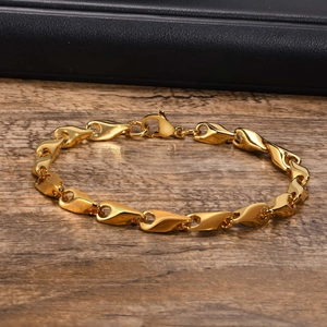 Polished gold stainless steel link chain bracelet with secure lobster clasp close-up