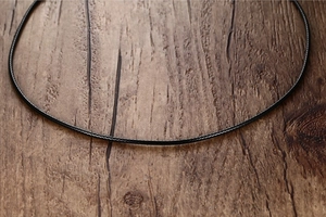 Close-up of black braided wax rope texture for DIY jewelry and necklaces