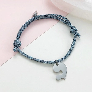 Braided couple bracelets with stainless steel magnetic heart charms in blue and gray